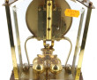 Pendulette en médal doré et balancier ro