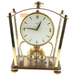 Pendulette en médal doré et balancier ro