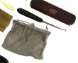 Lot comprenant 4 brosses dont une en arg