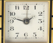CARTIER - Pendulette en métal doré émail