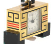 CARTIER - Pendulette en métal doré émail
