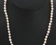 Collier shoker de perles blanches et ros