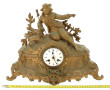Pendule XIXe en métal doré, vendue en l'
