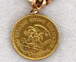 Bracelet or agrémenté d'une pièce de 20 