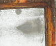 Petit miroir ancien à encadrement doré à