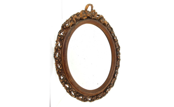 Miroir de forme ovale à décor de feuille