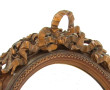Miroir de forme ovale à décor de feuille