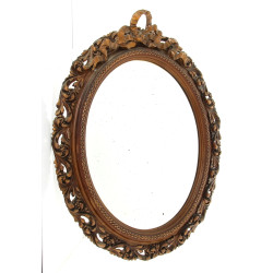 Miroir de forme ovale à décor de feuille