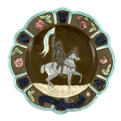 Plat décoratif en barbotine à décor en l