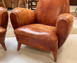 Deux fauteuils club anciens en cuir, ann