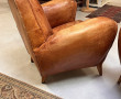 Deux fauteuils club anciens en cuir, ann