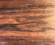Table en palissandre piétement à griffes
