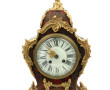Pendule cartel de style Louis XV en bron