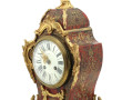 Pendule cartel de style Louis XV en bron