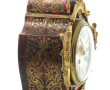 Pendule cartel de style Louis XV en bron