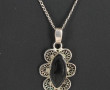 Deux pendentifs en argent dont un proven