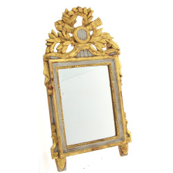 Miroir en bois sculpté et doré dans le g