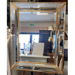 Grand miroir biseauté encadrement doré à