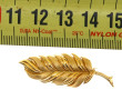 Broche plume en or jaune 18 cts, poinçon