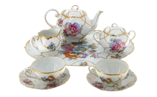 Tête à tête en porcelaine blanche et or 