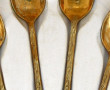 12 cuillères à moka en métal doré (en éc